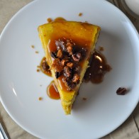 Pumpkin Praline Cheesecake with Bourbon-Caramel Sauce